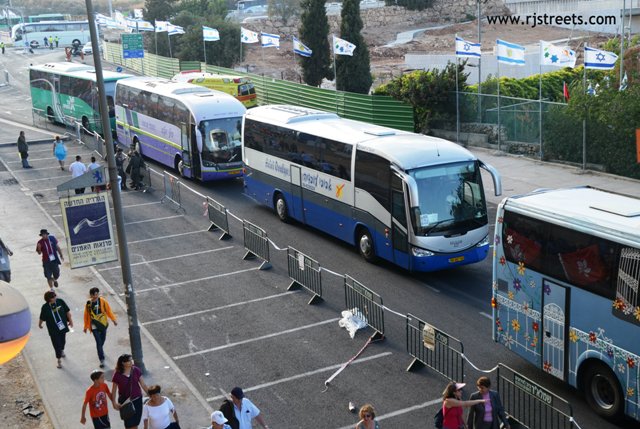 photo buses lined up at Teddy Stadium